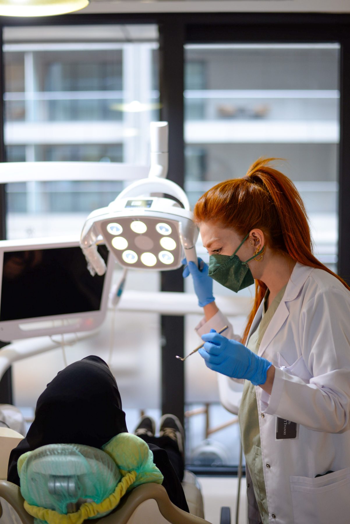 Dentist treating a patient in a modern clinic